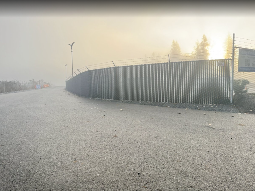 Commercial chain link security fence with angled security extensions